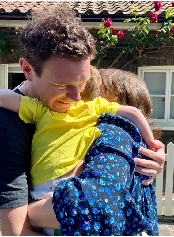 Princess Eugenie and Jack Brooksbank hugging Ernest Brooksbank