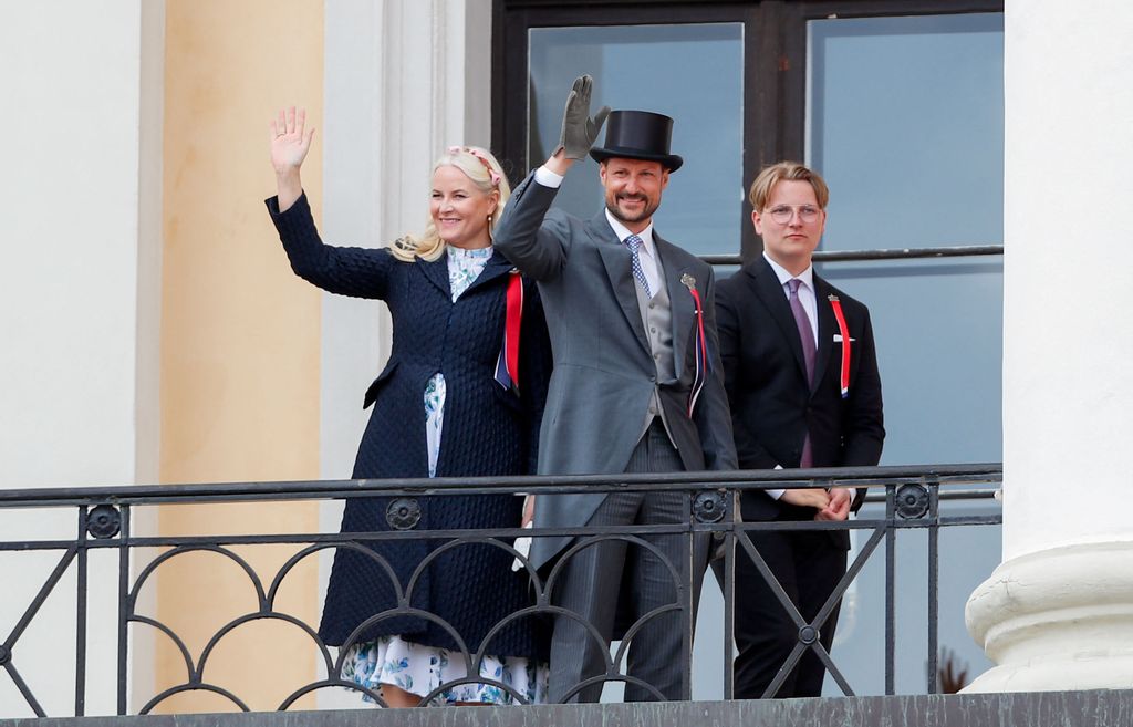 Crown Princess Mette-Marit, Crown Prince Haakon and Prince Sverre Magnus wave from the palace balcony
