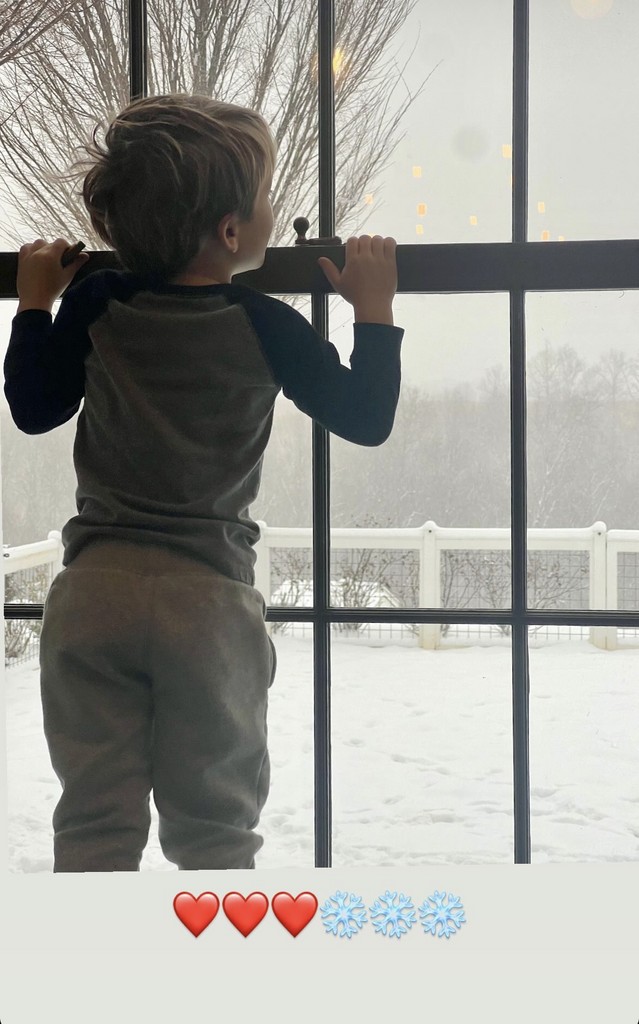 Carrie Underwood's son looks out on the magical scene at their home