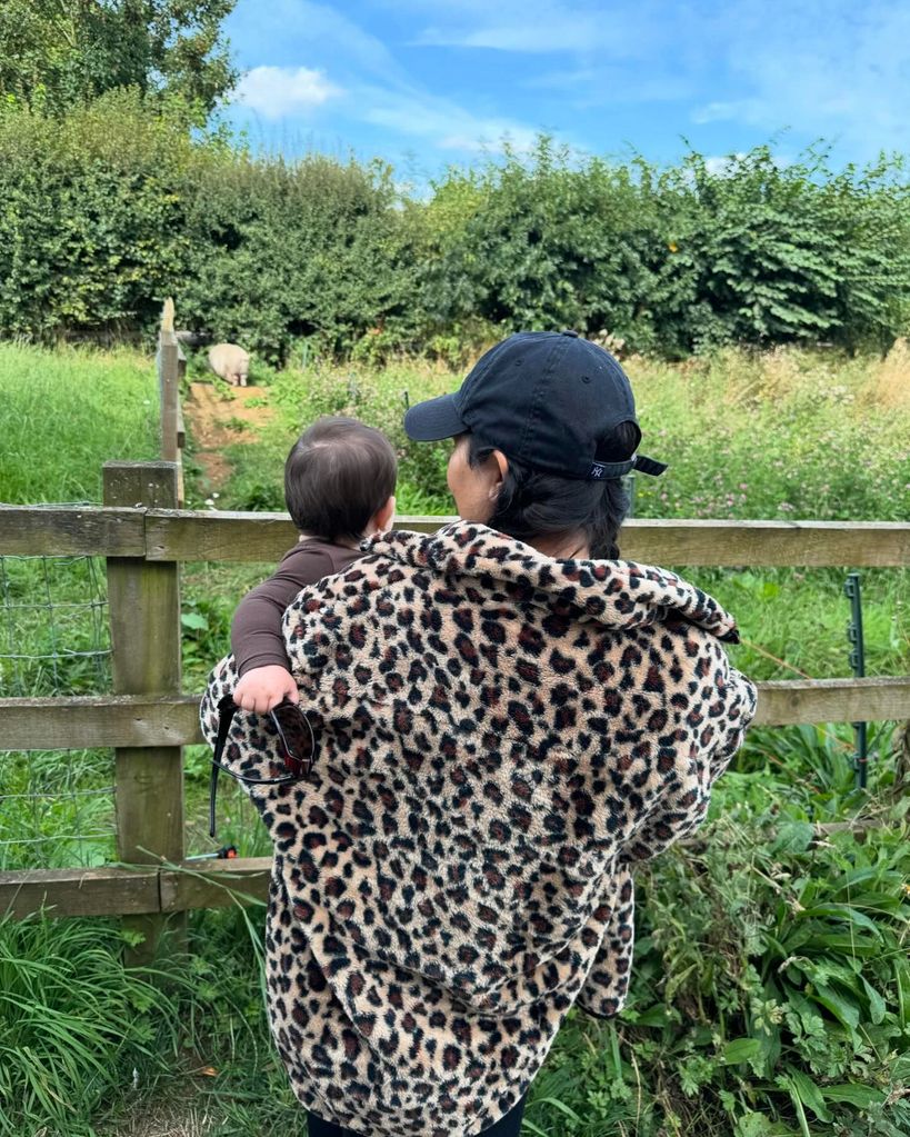 Kourtney Kardashian and holding baby Rocky 