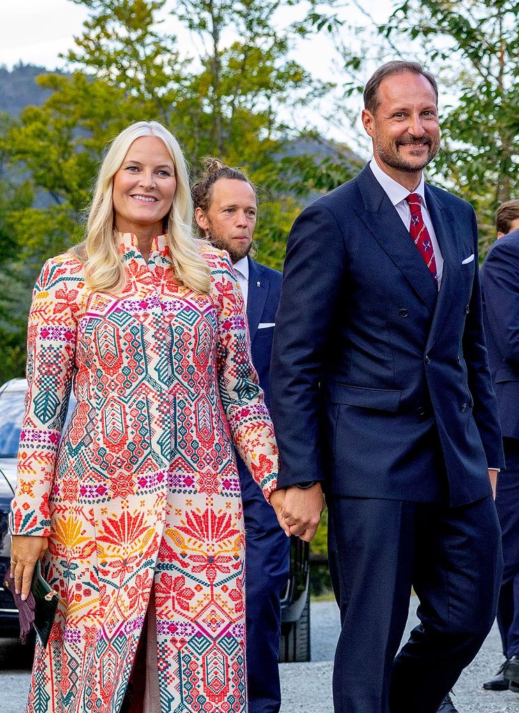 Crown Prince Haakon and Crown Princess Mette Marit holding hands