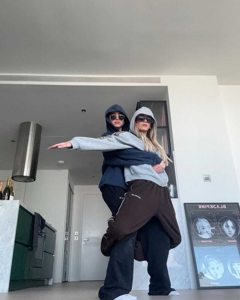 brooke and jess in hoodies in a funny pose