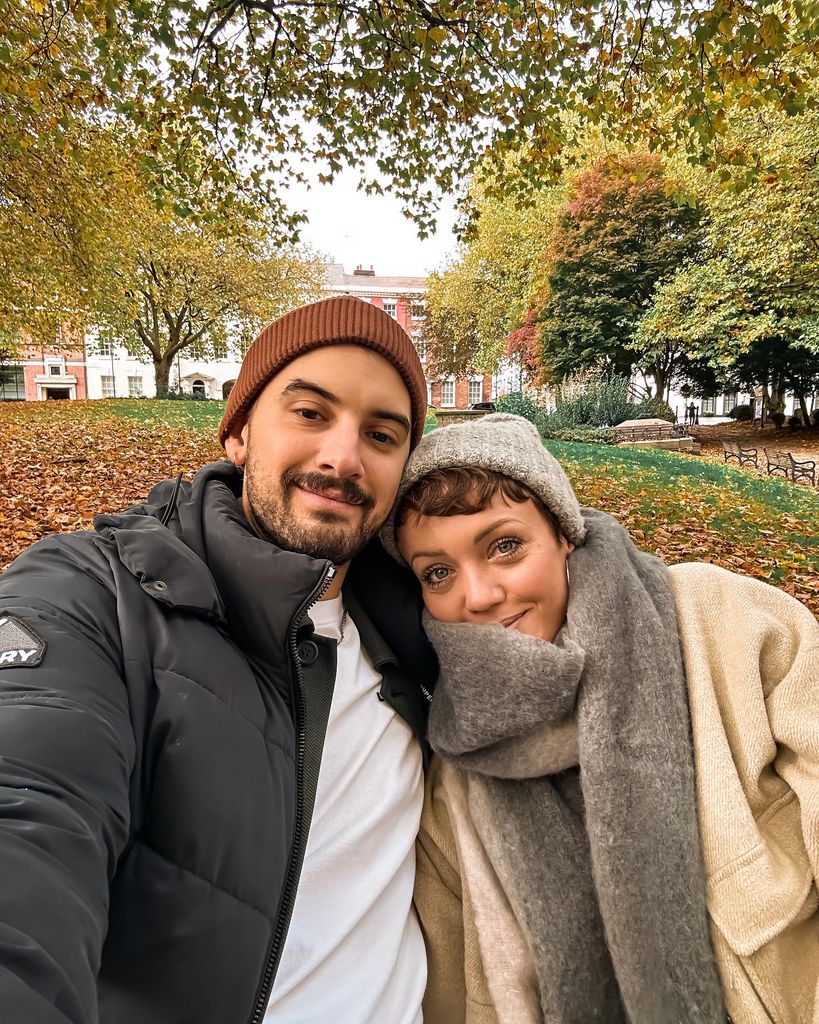 couple posing for autumn selfie