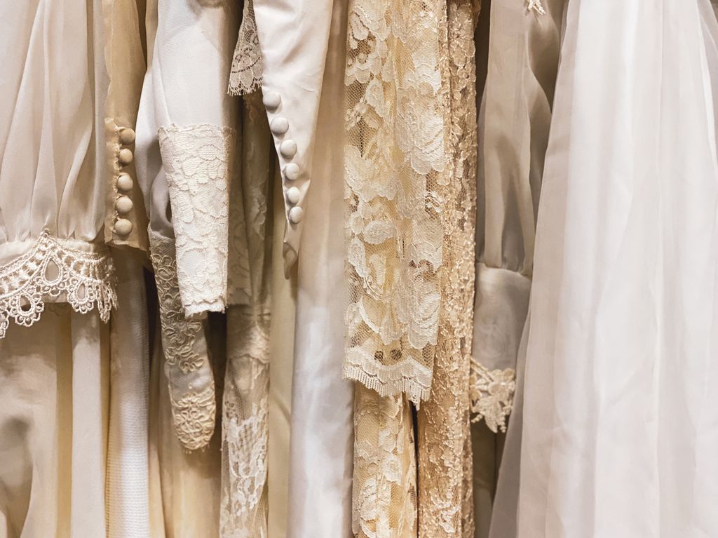vintage sustainable fashion rack of wedding dresses