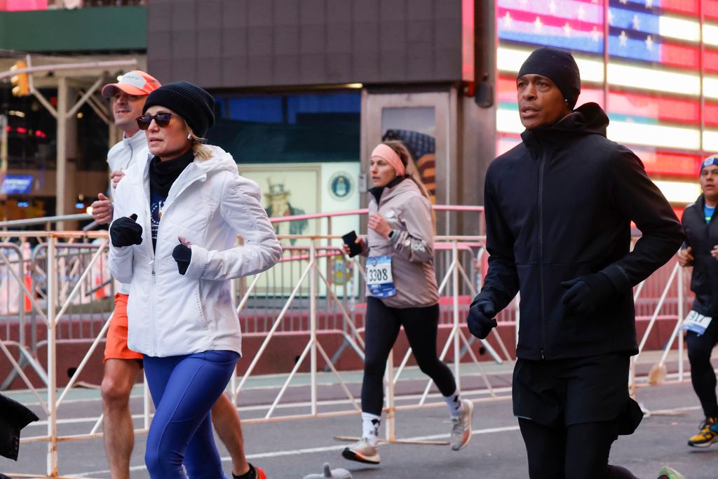Amy Robach and T. J. Holmes participates in the 2023 United Airlines NYC Half Marathon on March 19, 2023 in New York City