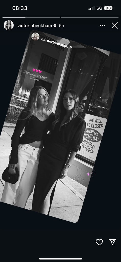 A black and white photo of Victoria and Harper Beckham