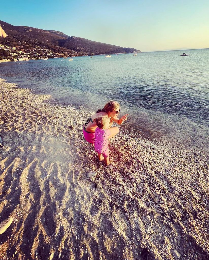 Carrie Johnson on the beach with her daughter in Barbie pink