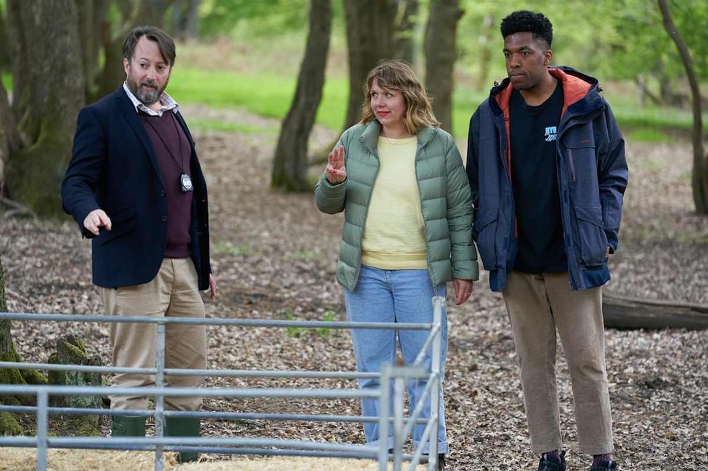 David Mitchell standing with Kerry Godliman and Toussaint Douglass