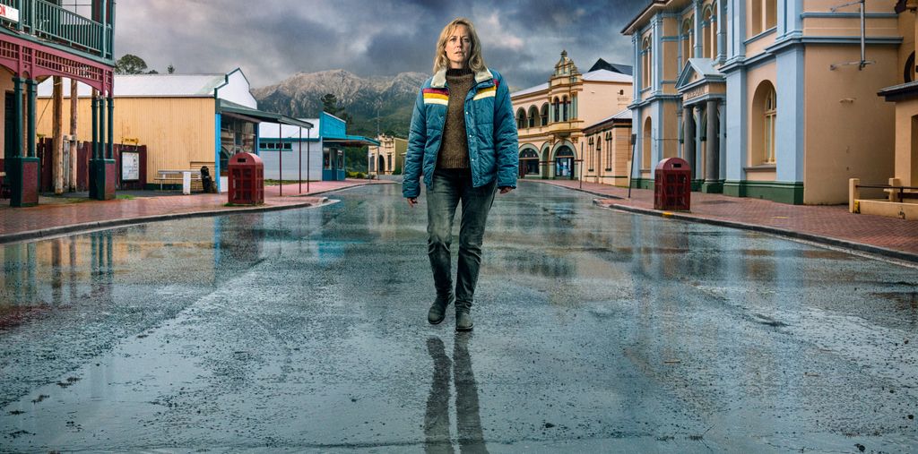 woman walking through empty street