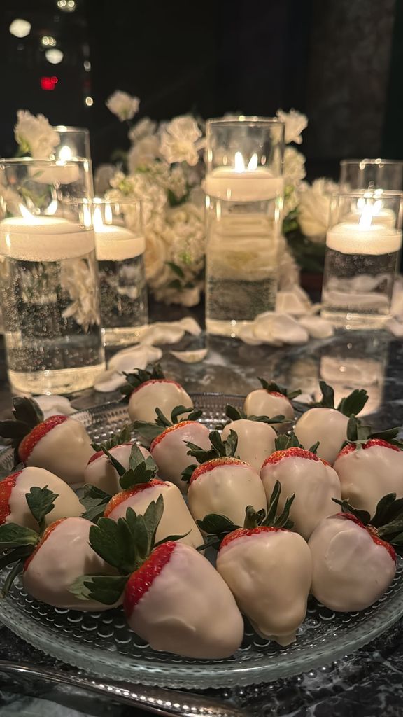 a plate of white chocolate covered strawberries