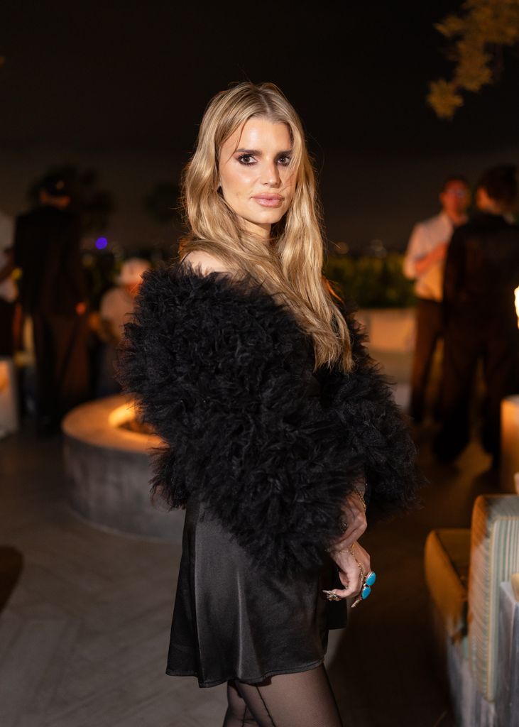 photo of jessica simpson wearing black fur coat