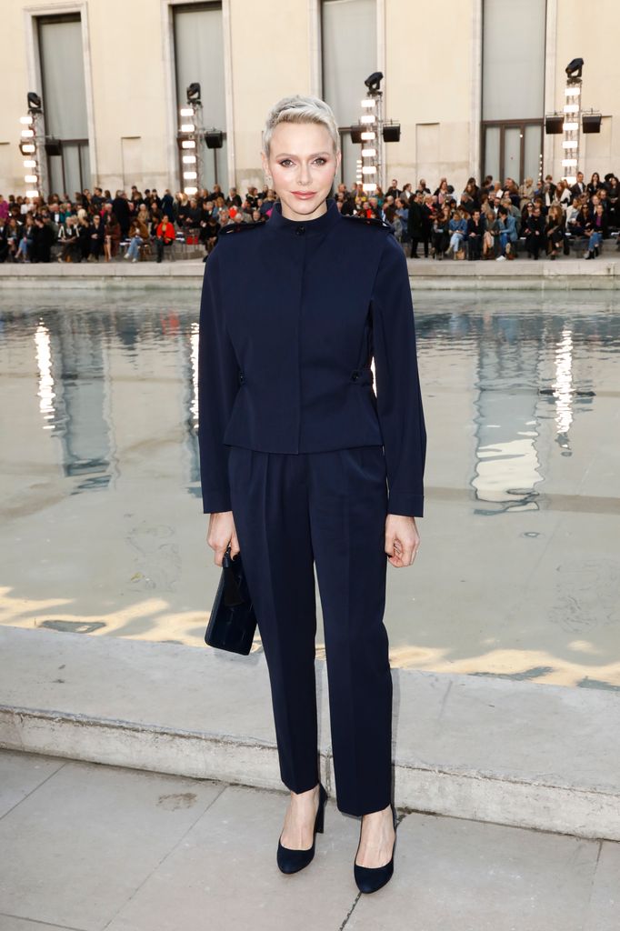 Princess Charlene of Monaco wears a navy suit to attend the Akris Womenswear Spring/Summer 2023 show as part of Paris Fashion Week  on October 01, 2022 in Paris, France.