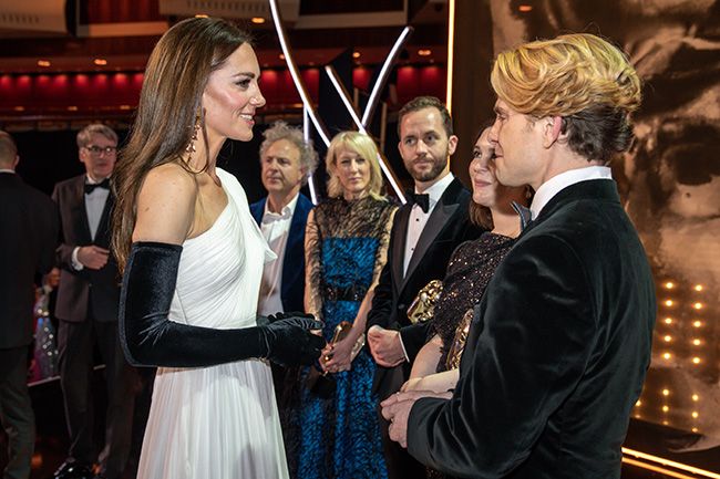 Kate Middleton talking to BAFTA winners onstage after the awards ceremony