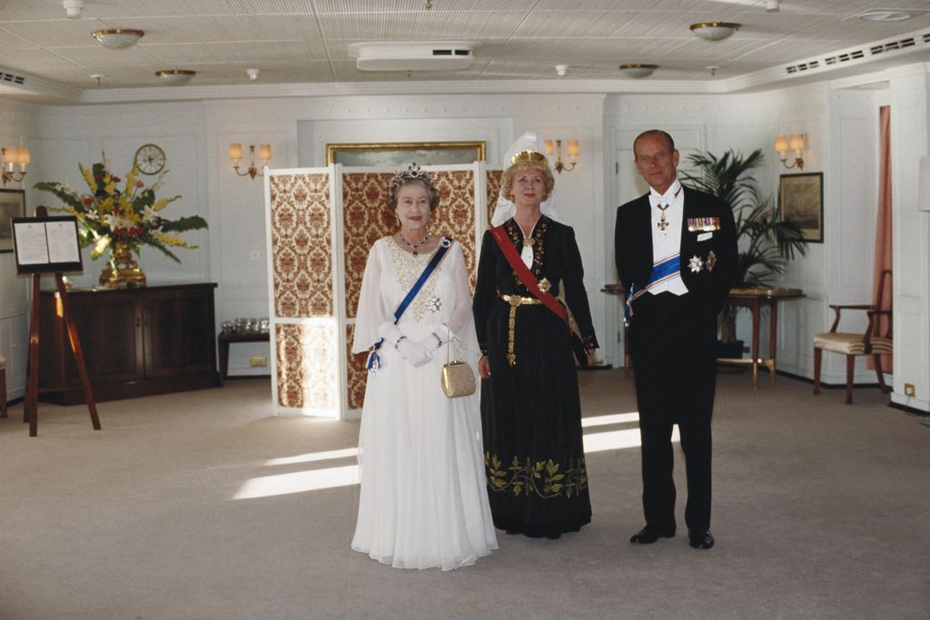 Queen Elizabeth II, President of Iceland, Vigdis Finnbogadottir, and Prince Philip on board the royal yacht Britannia