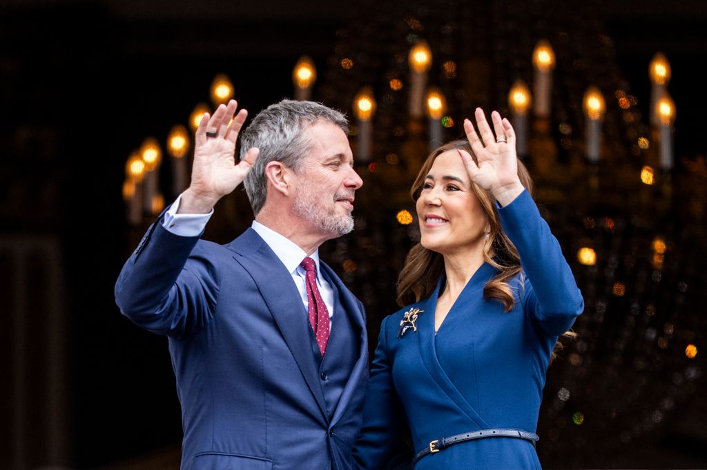 King Frederik and Queen Mary wave from the balcony of Frederik VIII's Palace on the occasion of his 57th birthday