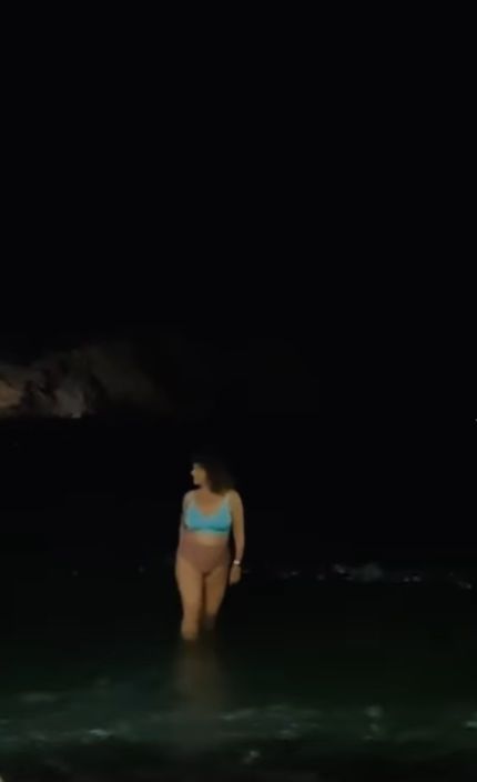 Nadia Sawalha in the ocean in blue bikini