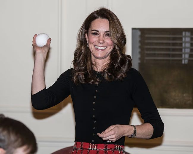 Kate Middleton throws a fake snowball at a party in 2018