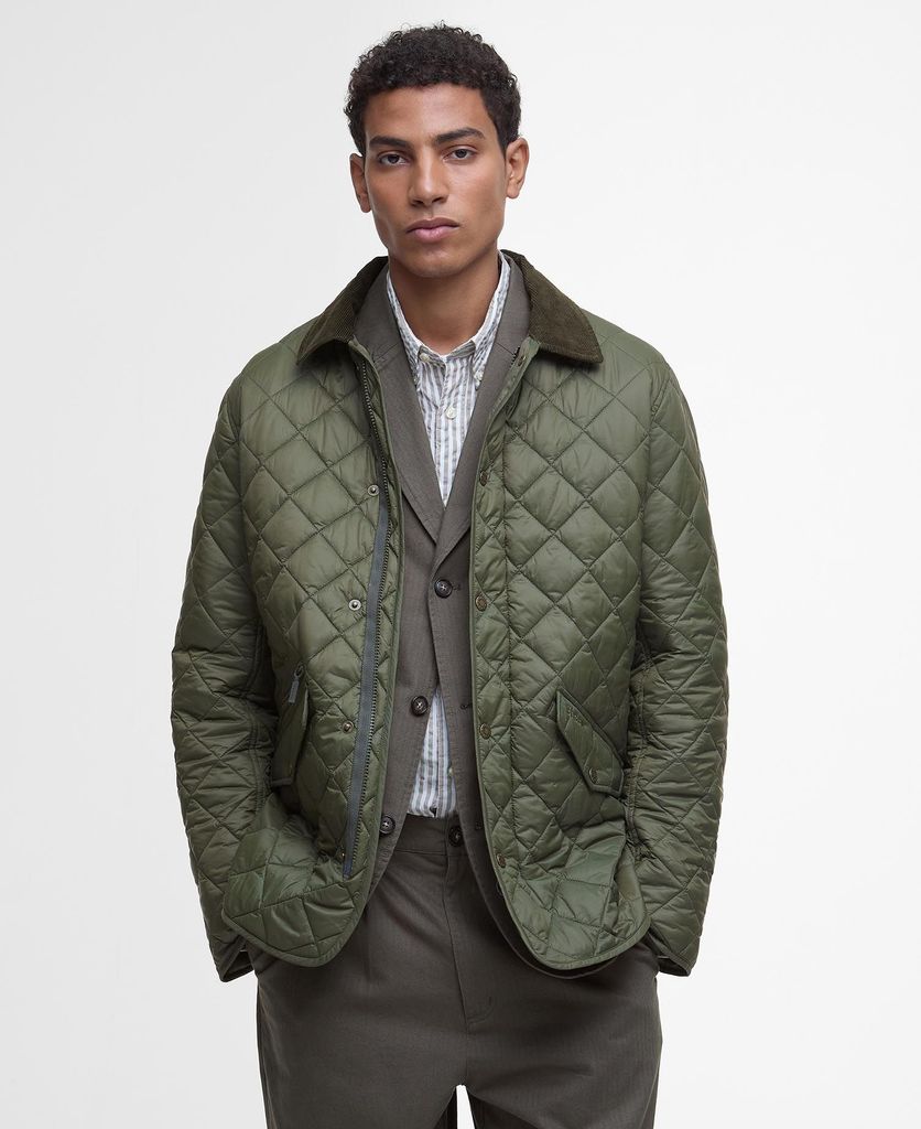 quilted green Barbour jacket worn on a model with a suit