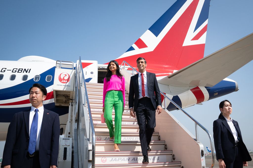 IN FLIGHT - MAY 18:  British Prime Minister Rishi Sunak and his wife Akshata Murty disembark their plane as they arrive at Tokyo Airport ahead of the G7 Summit on May 18, 2023 in Tokyo, Japan. The G7 summit will be held in Hiroshima from 19-22 May.  (Photo by Stefan Rousseau - WPA Pool/Getty Images)