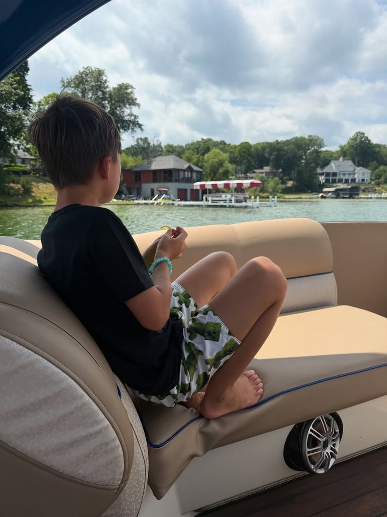 Wolfie Mapelli Mozzi sitting on a boat