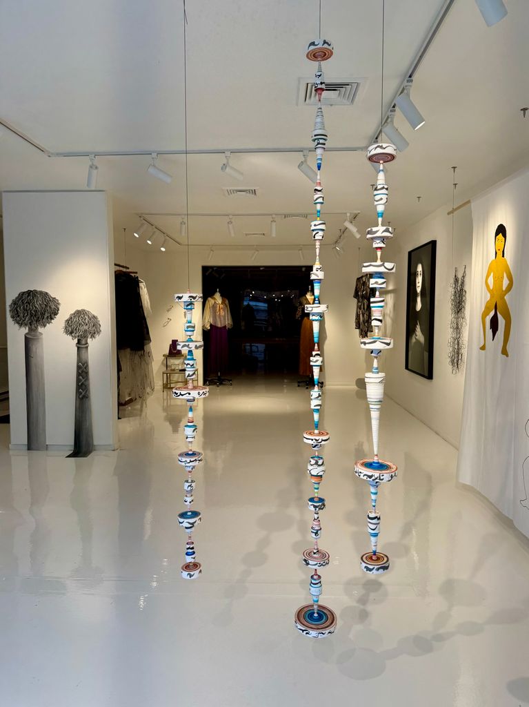 Inside Angelina Jolie's Atelier Jolie, during an exhibit titled Strand for Women; the building was formerly owned by Andy Warhol and it was the last place Jean-Michel Basquiat lived in before his death at 27 in 1988