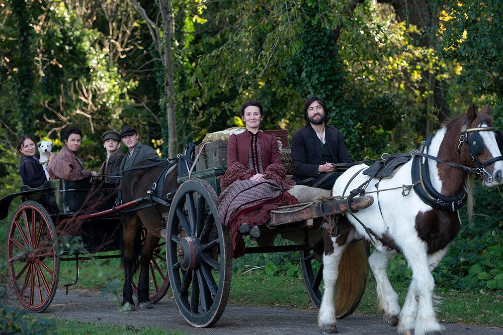 The Hardacre family riding in a carriage