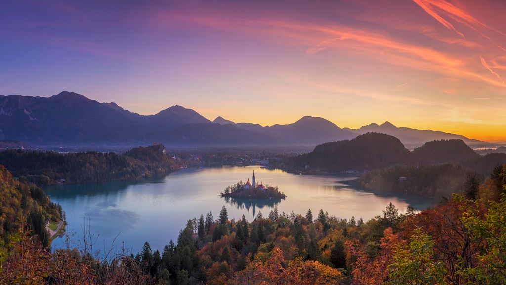 Lake Bled and the island with the church at autumn color at sunrise