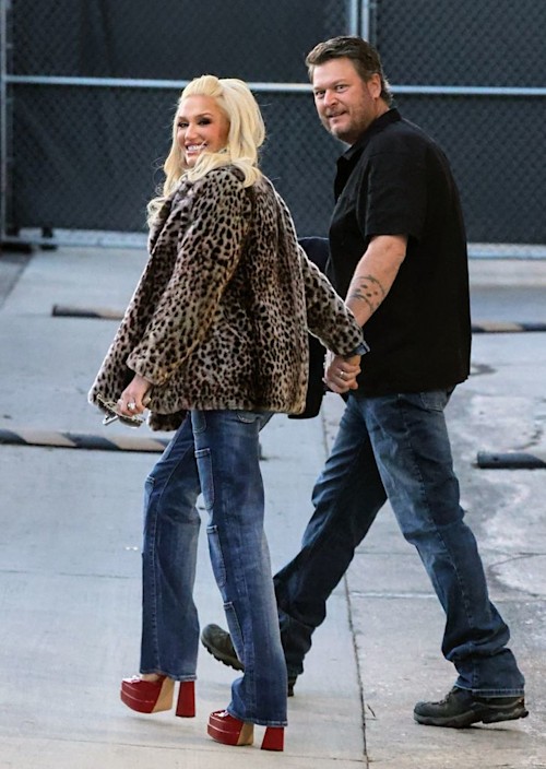 Gwen in leopard print coat walking with blake