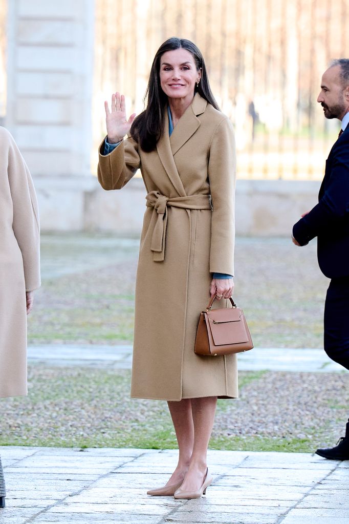 Queen Letizia in a tan longline coat with Leonor's bag