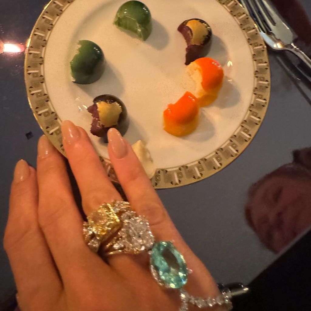 blake lively hand with rings by plate of food