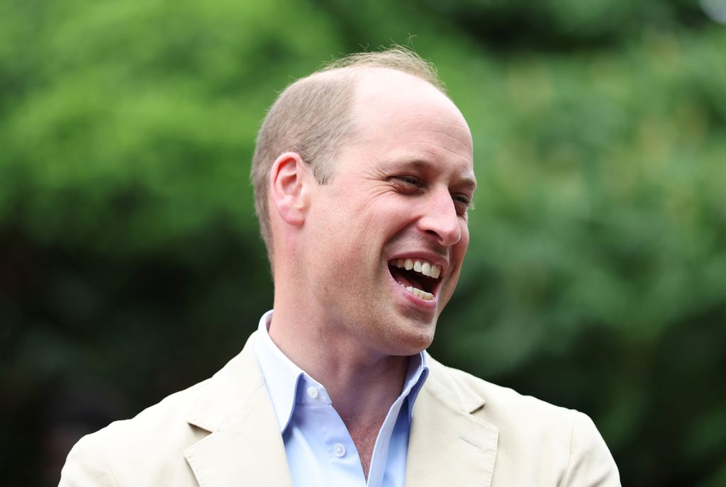 Prince William laughing in a blazer