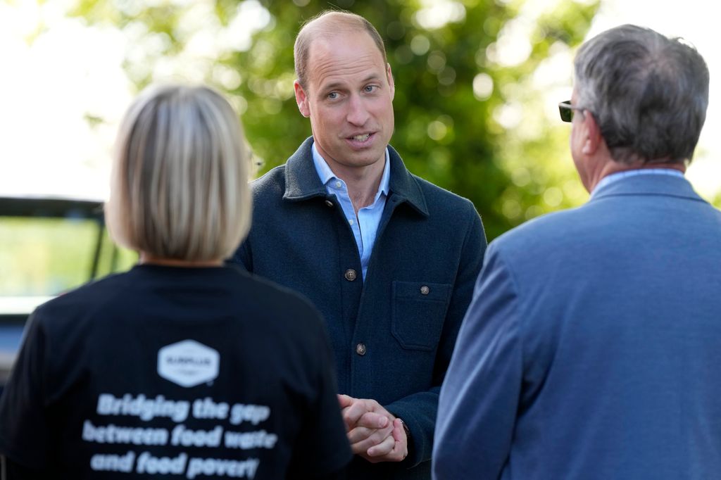 Prince William smiles as he arrives at Surplus to Supper