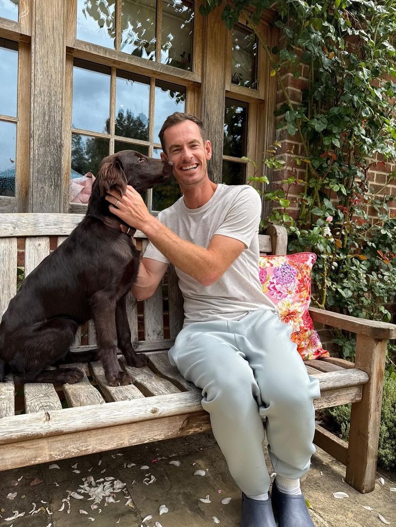 Andy Murray smiling with his new puppy