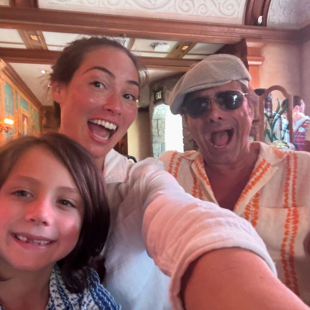 john stamos smiling in photo with wife and son