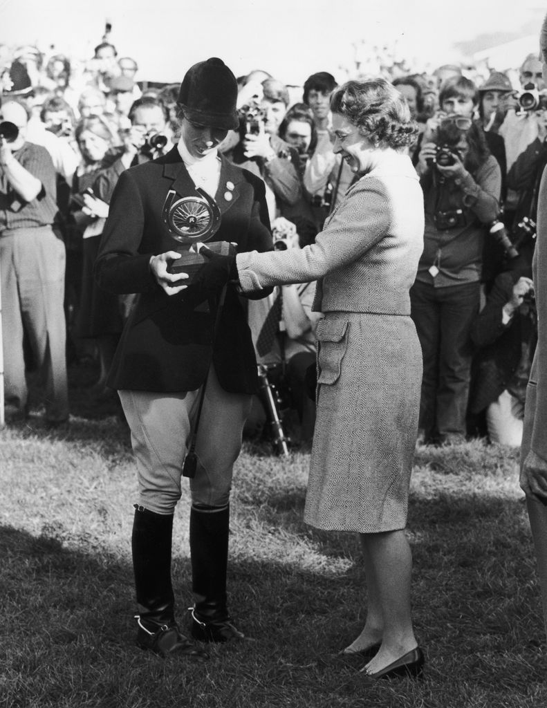 The late Queen presenting the Raleigh trophy to Anne, winner of the individual European three-day event at Burghley