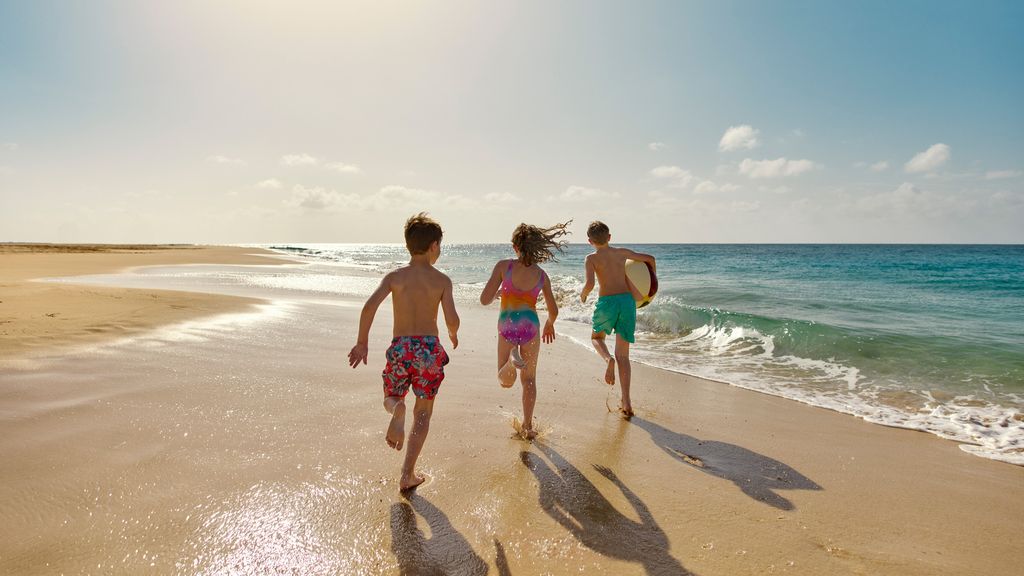 Kids running on beach