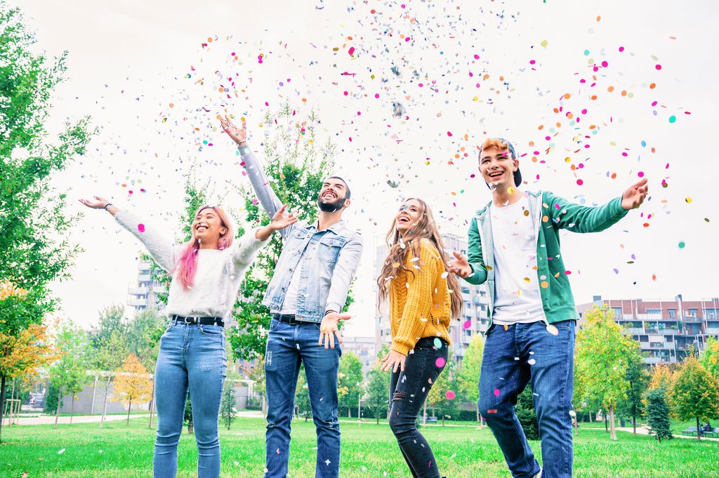 students celebrating with confetti 