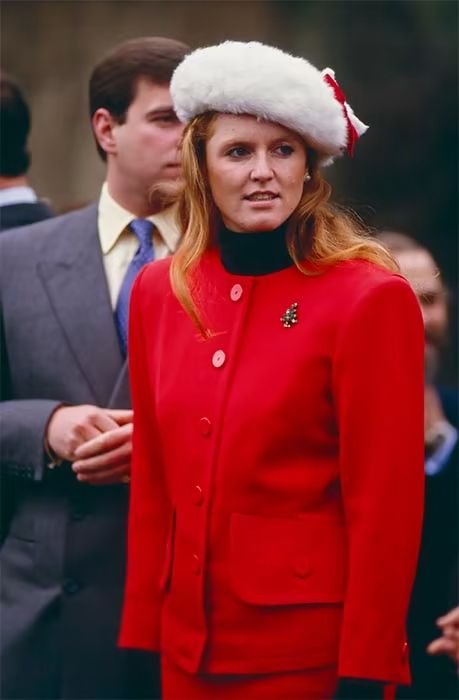 Sarah Ferguson wears a red coat and furry hat on Christmas Day 1987