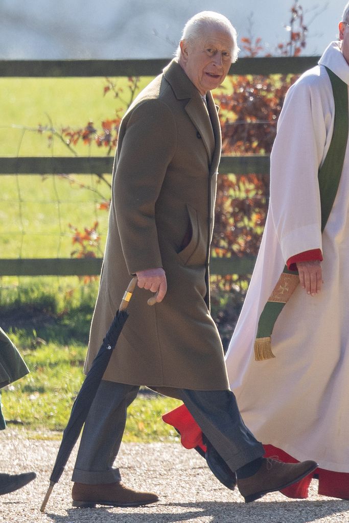 man walking to church with umbrella in hand 