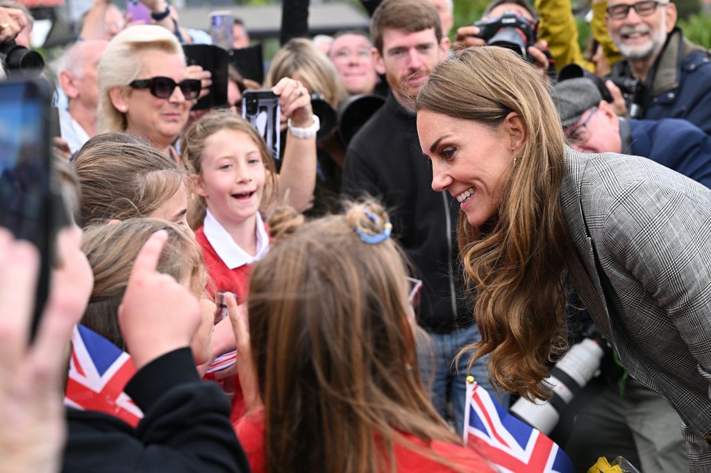 Kate talking to school children outside Sudbury Silk Mills
