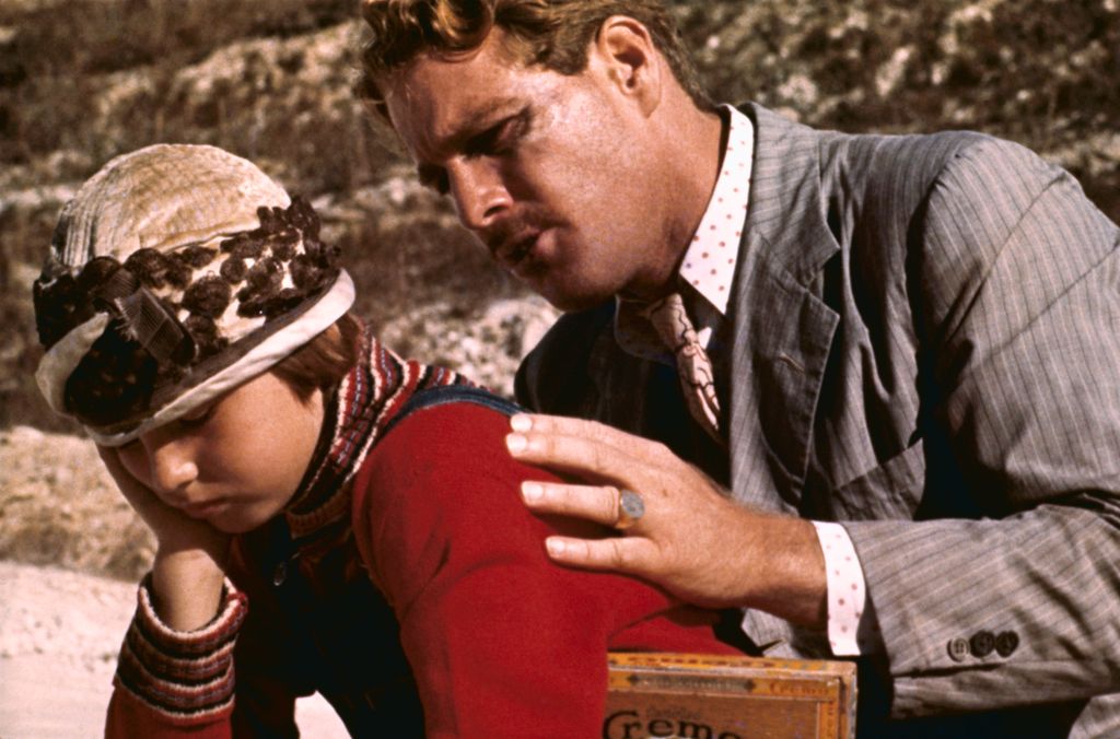 Actor Ryan O'Neal speaks to his daughter, Tatum, in a scene from the movie Paper Moon