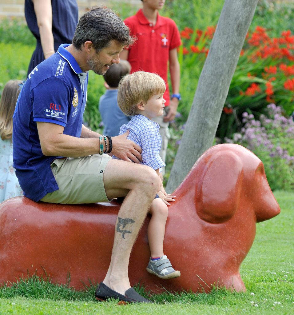 King Frederik with shark tattoo on leg