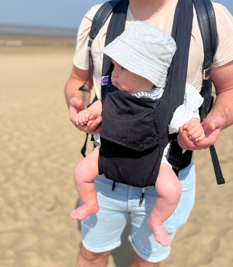 baby-in-carrier-on-father