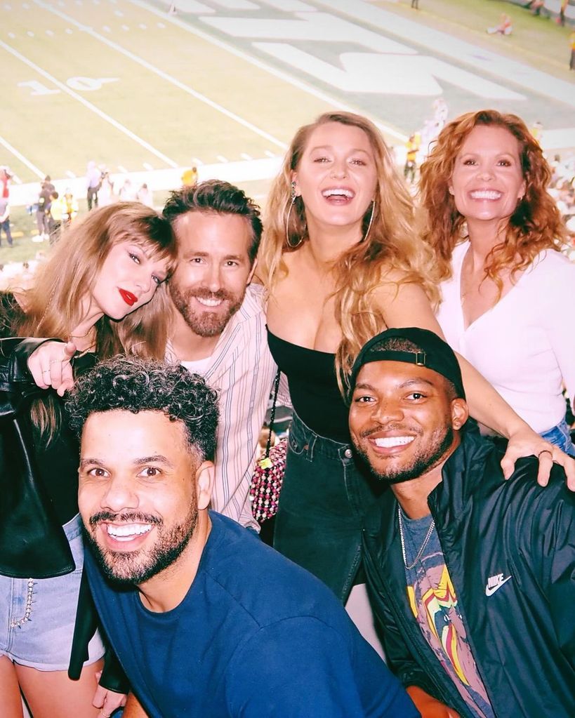 Taylor Swift, Ryan Reynolds and Blake Lively take a photo with friends at a Chiefs game