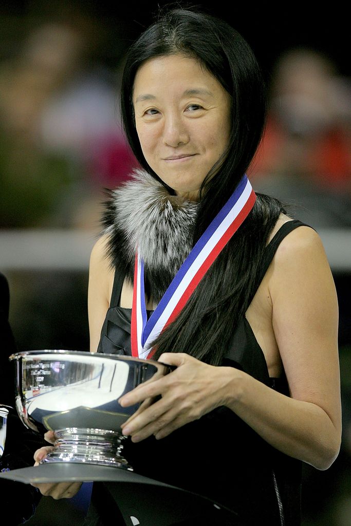 Vera Wang holding a silver trophy