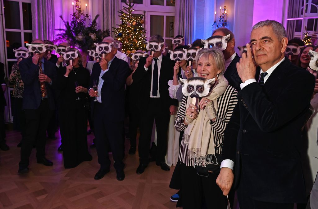 Rowan Atkinson (R) and guests 