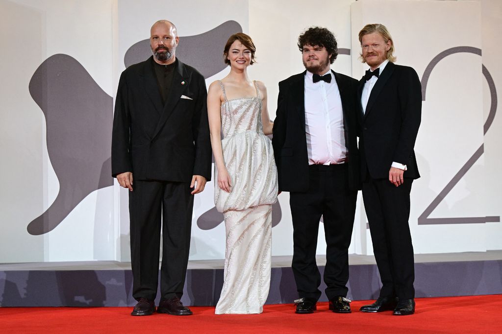 Greek director and screenwriter Yorgos Lanthimos, US actress Emma Stone, US actor Aidan Delbis and US actor Jesse Plemons pose on the red carpet before the screening of the movie "Bugonia" presented in competition at the 82nd International Venice Film Festival