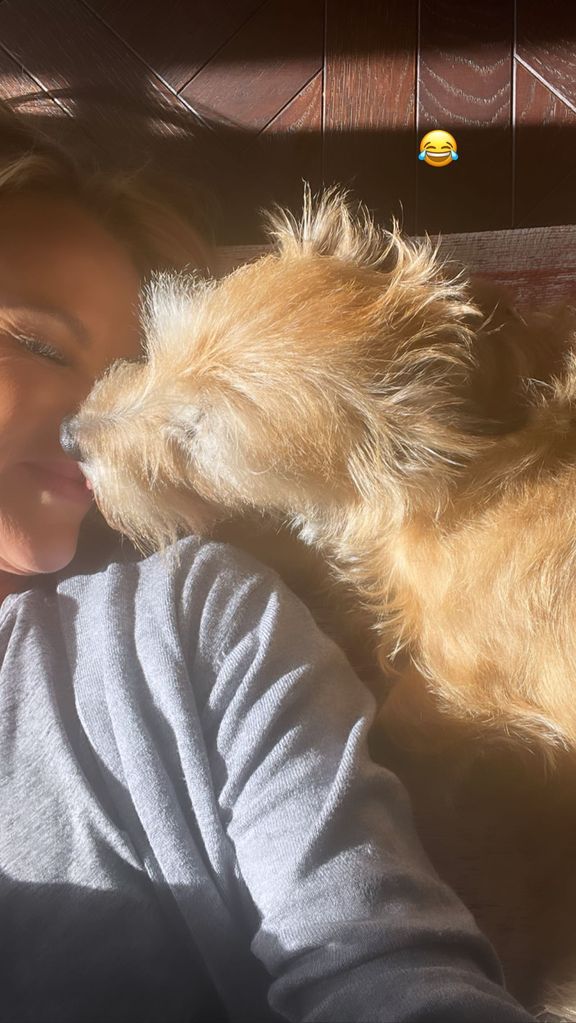 Amanda Holden kissing her dog Rudie 