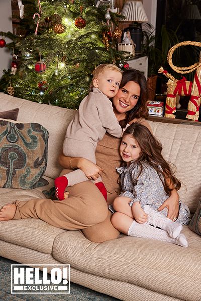 Binky Felstead cuddles her kids infront of Christmas tree