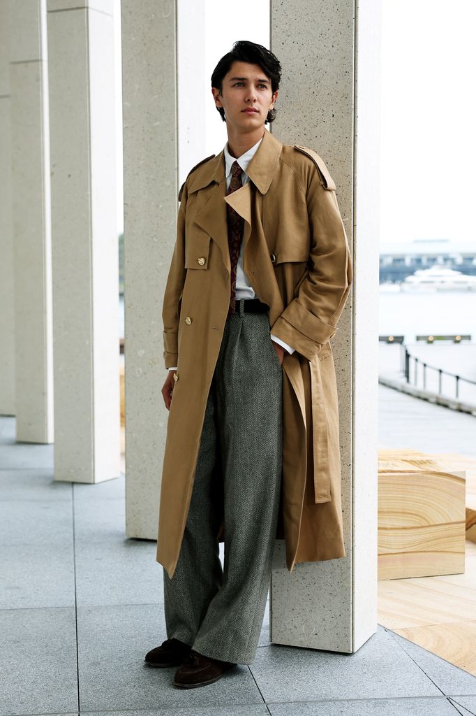 model posing in trench coat 